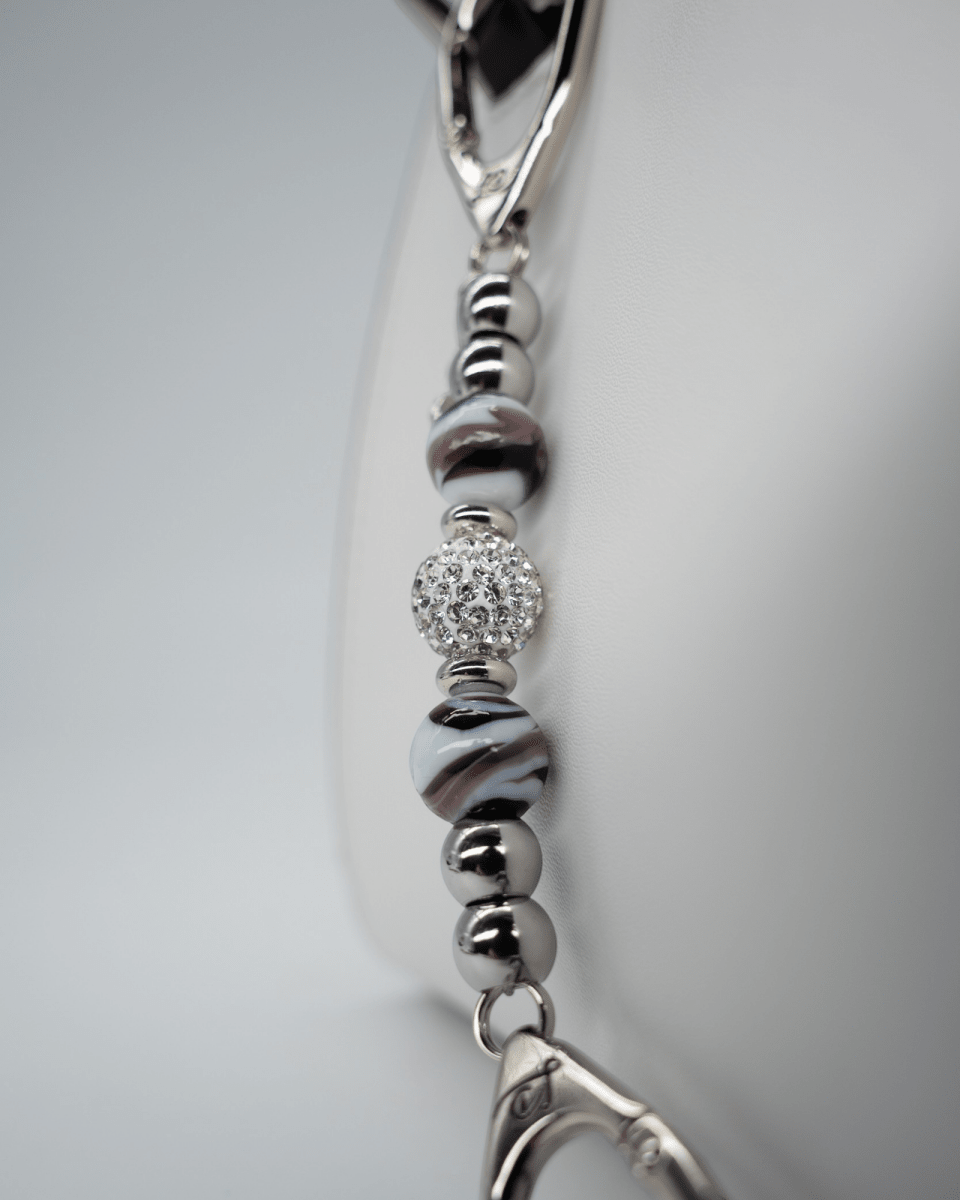 LD Keyfinder Purple Swirl Mini keychain with lampwork purple and white swirl glass beads and a crystal center bead.