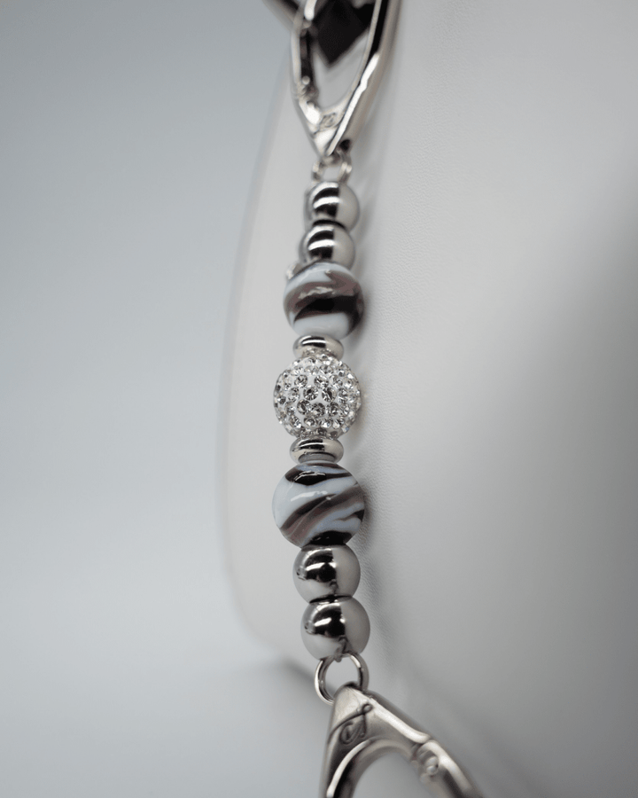 LD Keyfinder Purple Swirl Mini keychain with lampwork purple and white swirl glass beads and a crystal center bead.