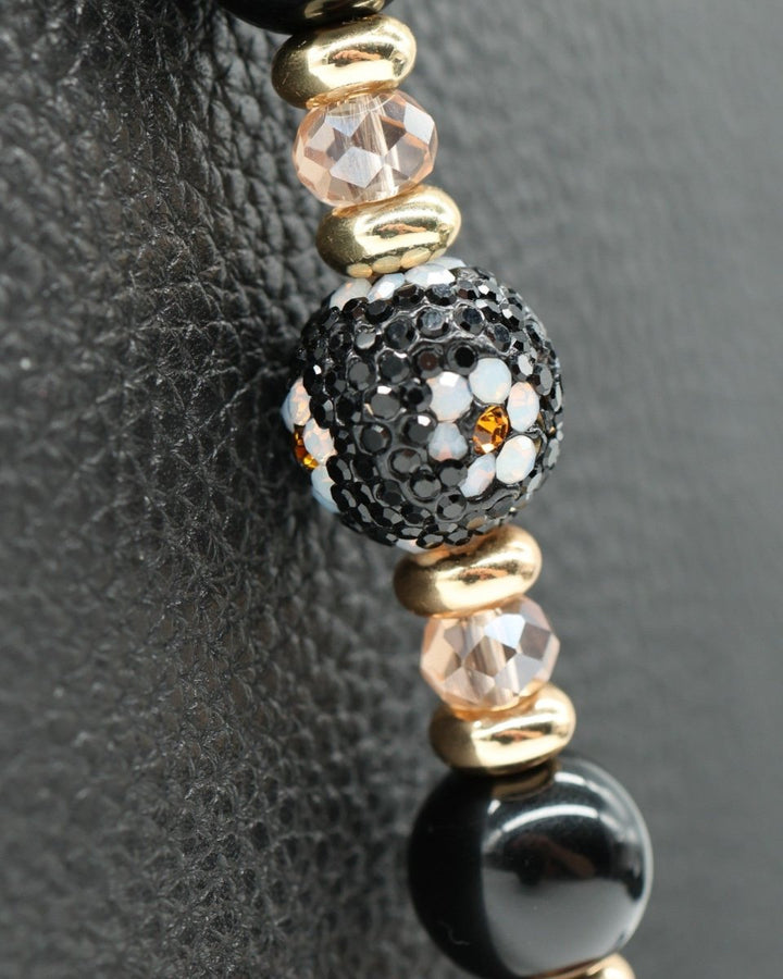 LD Keyfinder Queen Bee II bracelet with black obsidian, gold, and crystal daisy beads.