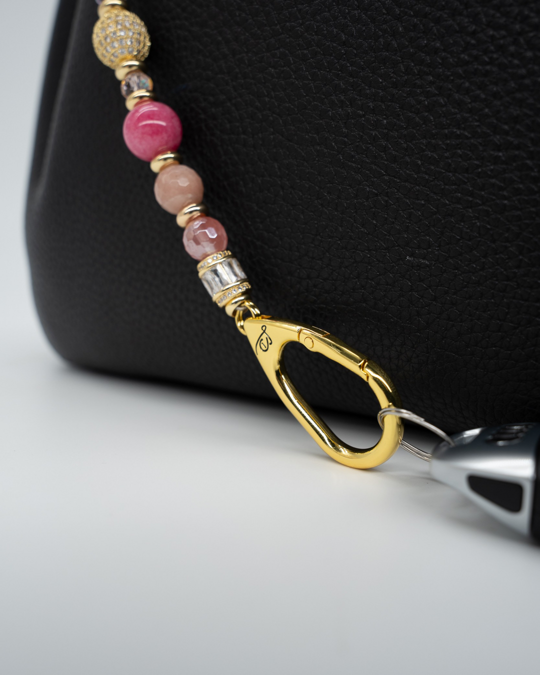 LD Keyfinder Radiant Hope beaded keychain with pink gemstones, gold-plated pavé beads, and a pink ribbon heart charm.