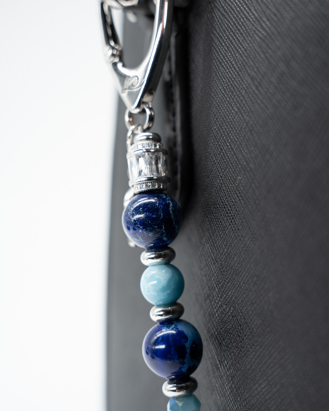 LD Keyfinder Sapphire Allure accessory featuring blue jasper, larimar, and glass beads with platinum-plated accents.