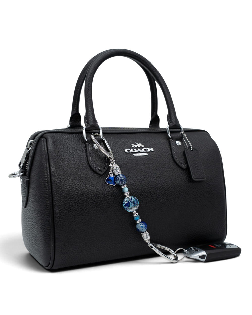 LD Keyfinder Petite Sapphire Allure featuring blue artisan glass, jasper, and jade beads attached to a black handbag.