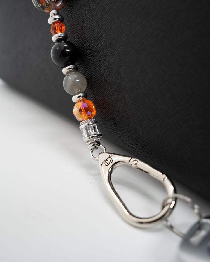 LD Keyfinder Spellbound Halloween accessory with black obsidian, moonstone, orange glass beads, and witch charm.