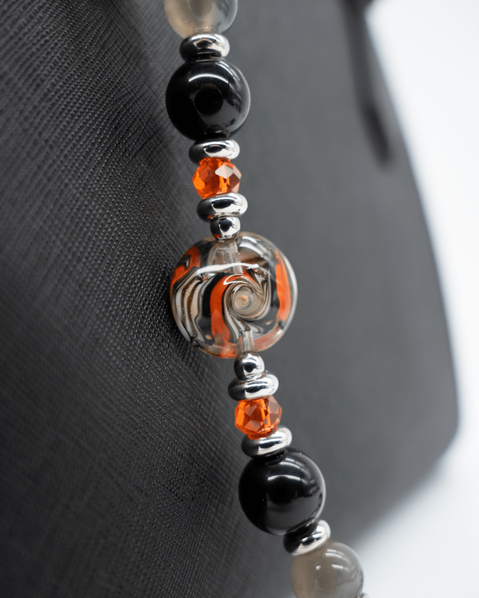 LD Keyfinder Spellbound Halloween accessory featuring black obsidian, moonstone, orange glass beads, and a witch charm.