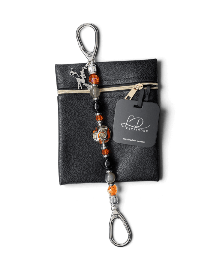 LD Keyfinder Spellbound Halloween beaded keychain with obsidian, moonstone, orange glass, and a witch charm on a pouch.