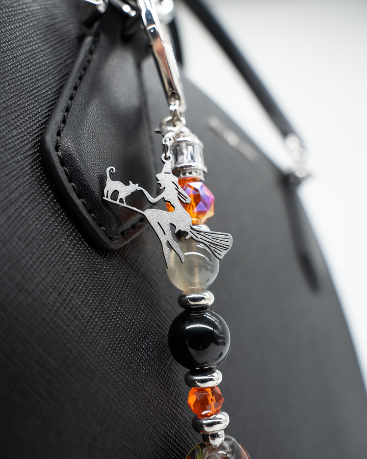 LD Keyfinder Spellbound Halloween accessory featuring a witch charm, obsidian, moonstone, and orange glass beads.