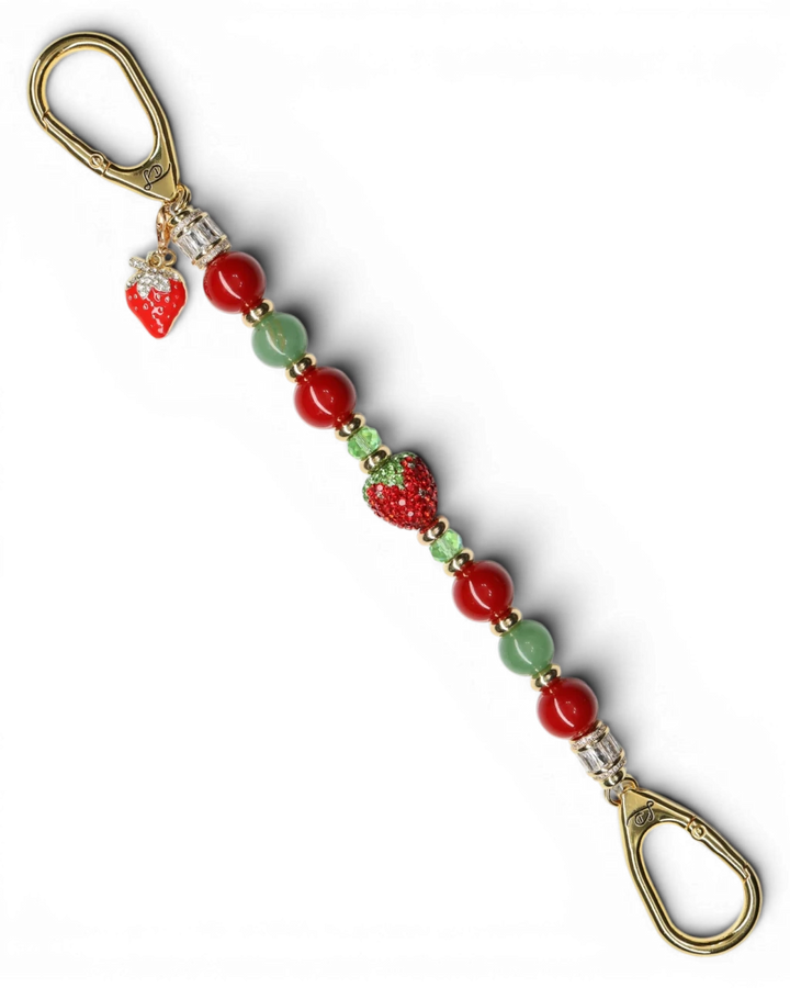 LD Keyfinder Strawberry Fields keychain with red shell pearls, green aventurine, crystal strawberry, and gold charm.