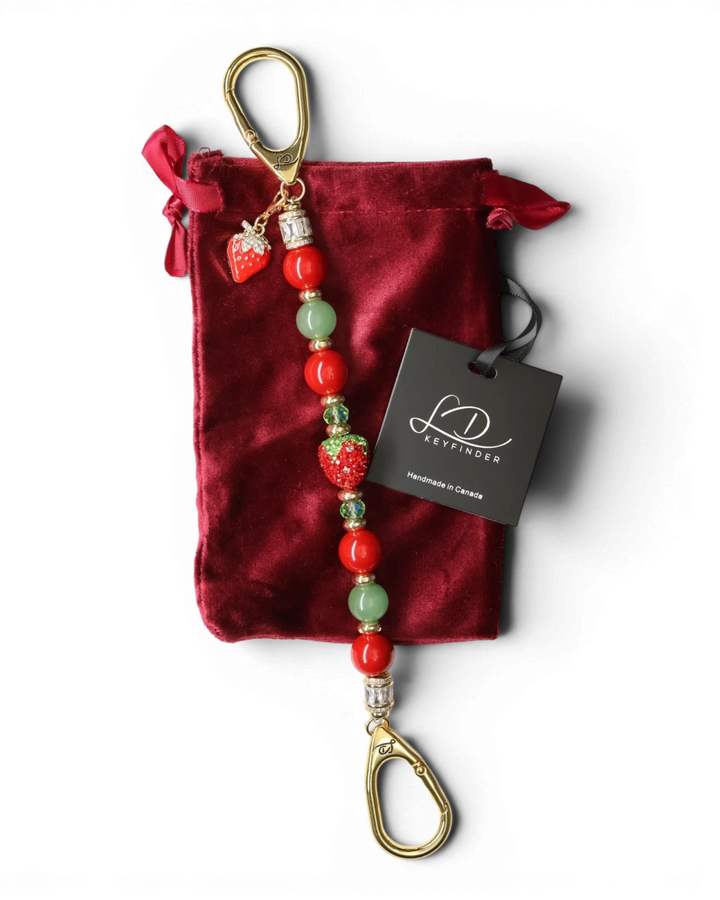 LD Keyfinder Strawberry Fields beaded keychain with red shell pearls, green aventurine, and crystal strawberry charm.