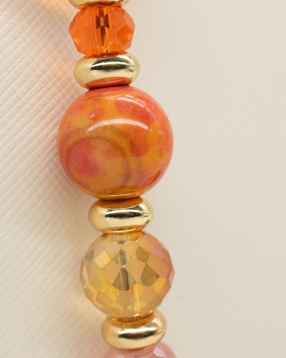 LD Keyfinder Summer Sunset beaded accessory featuring faceted cherry quartz, orange agate, and gold-plated accents.