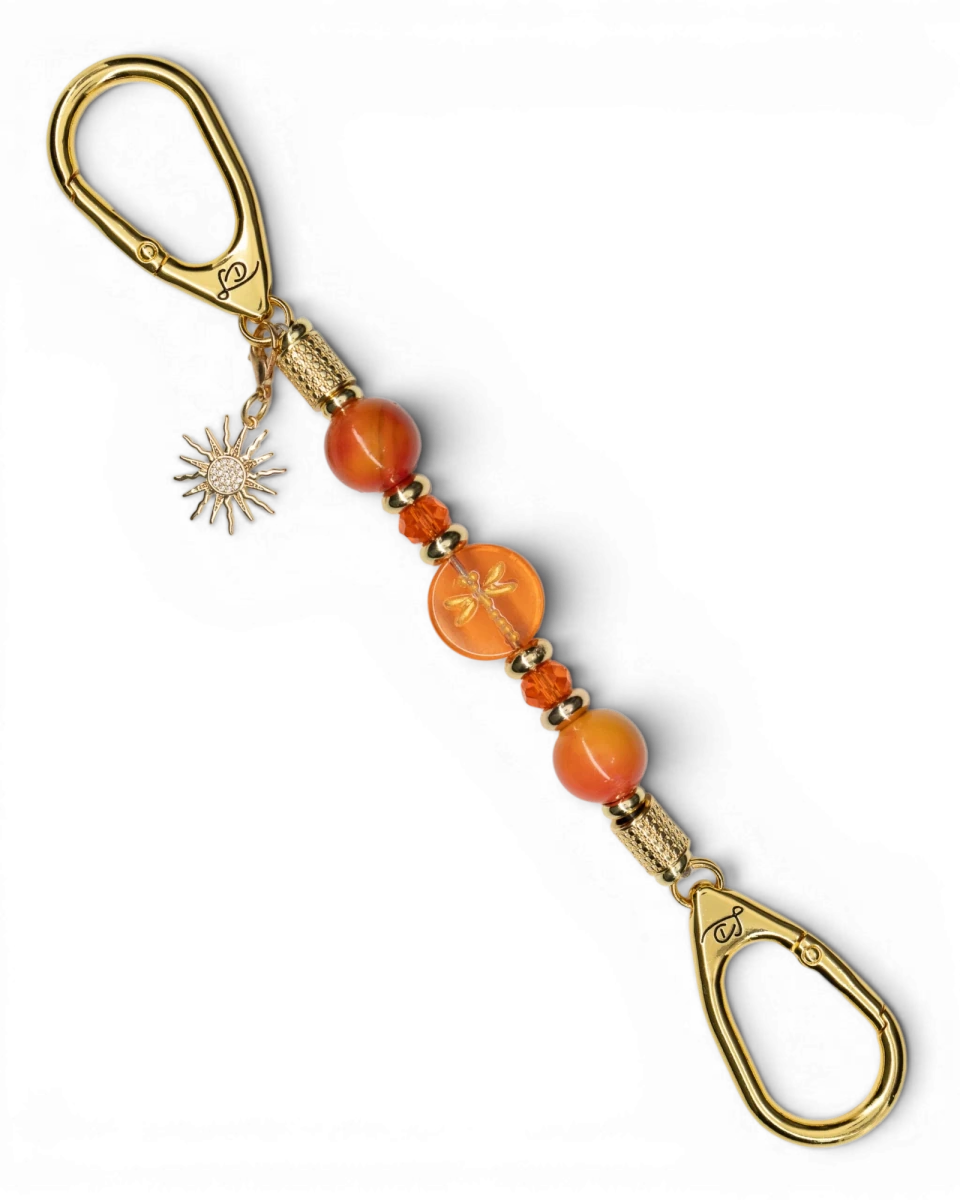 LD Keyfinder Summer Sunset Mini keychain with coral glass dragonfly bead, red agate, and gold-plated sun charm.