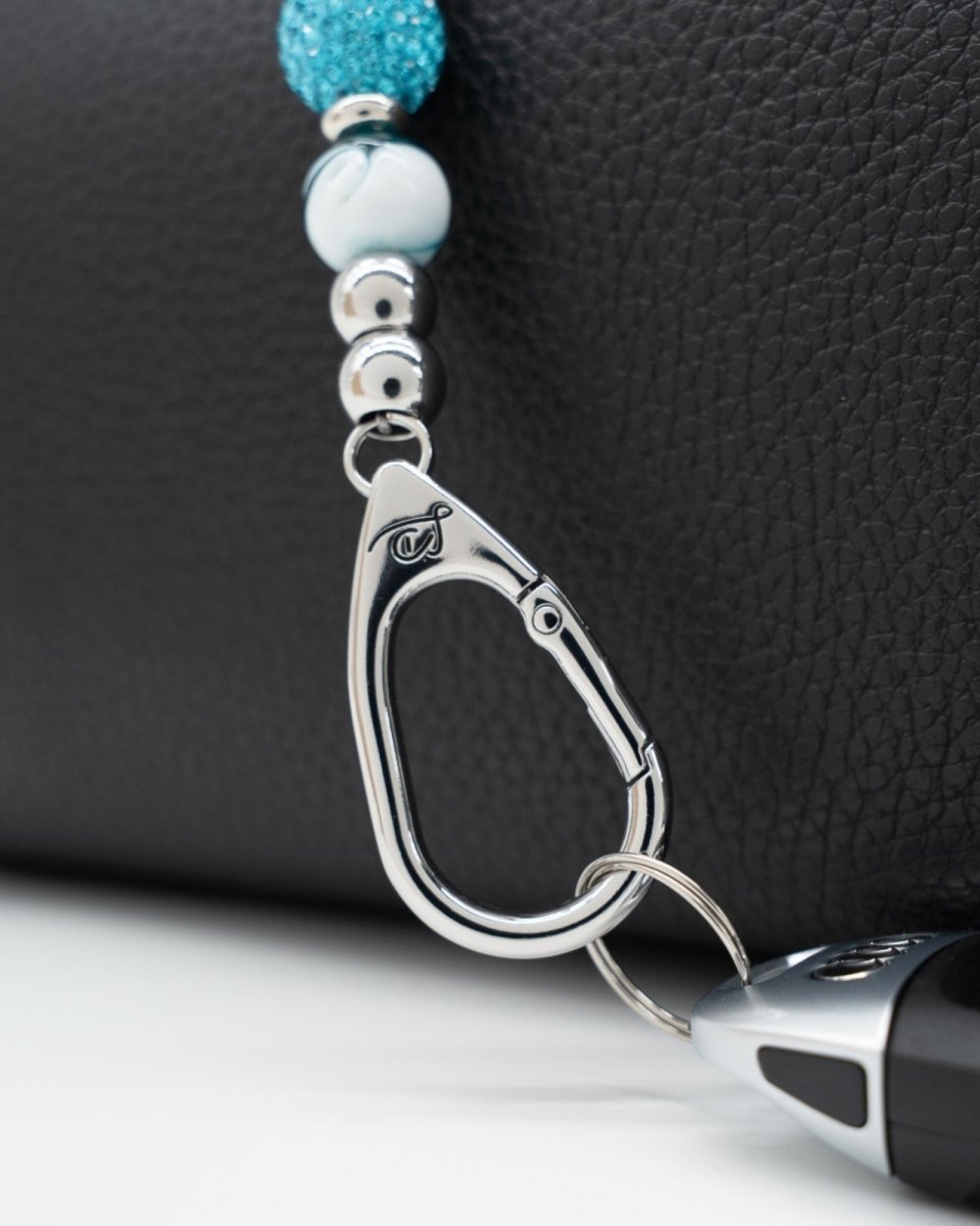 LD Keyfinder Teal My Heart-Mini keychain featuring teal swirl glass beads and a silver-plated heart charm on a bag.