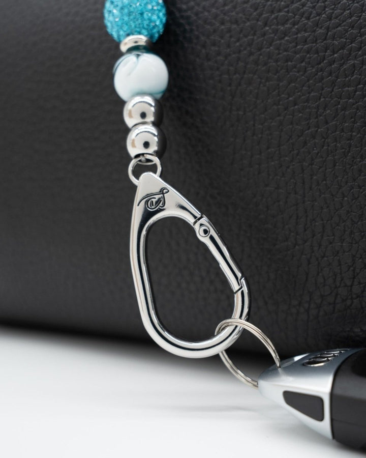 LD Keyfinder Teal My Heart-Mini keychain featuring teal swirl glass beads and a silver-plated heart charm on a bag.