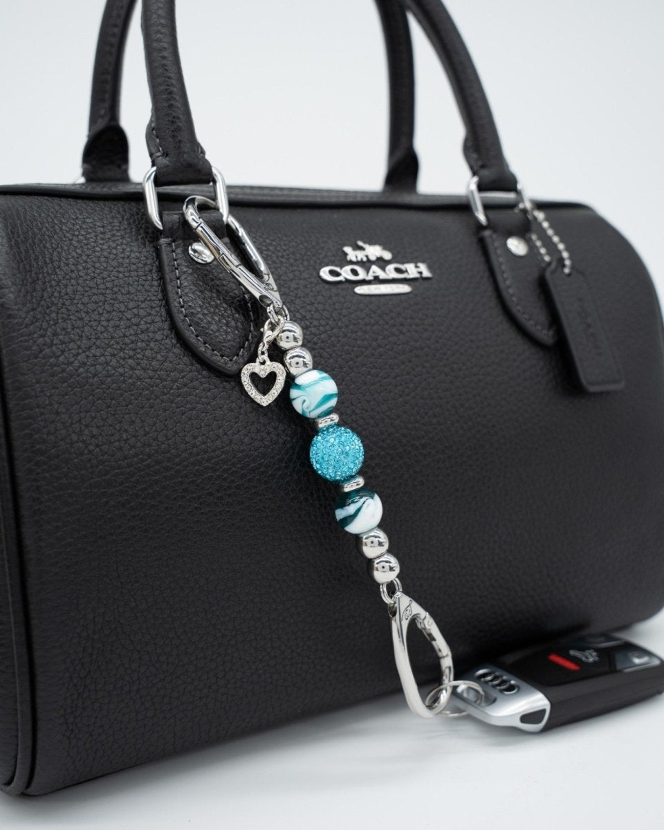 LD Keyfinder Teal My Heart-Mini keychain with teal swirl glass beads, crystal center, and silver heart charm on bag