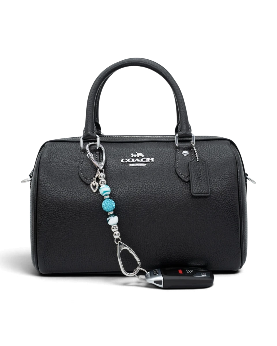 LD Keyfinder Teal My Heart-Mini keychain with teal swirl glass beads and a silver rhinestone heart on a black handbag