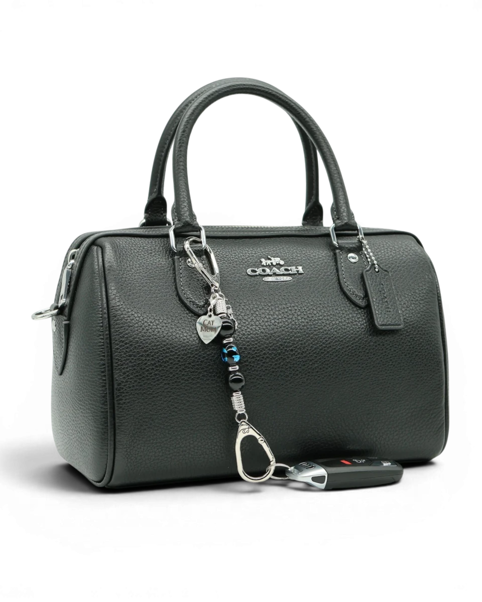 LD Keyfinder Whisker Dreams-Mini beaded accessory with black obsidian and blue cat glass charm attached to a handbag