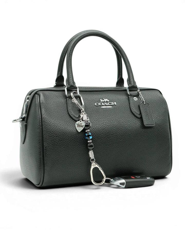LD Keyfinder Whisker Dreams-Mini beaded accessory with black obsidian and blue cat glass charm attached to a handbag