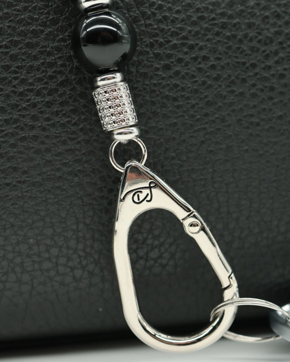 LD Keyfinder Whisker Dreams-Mini featuring black obsidian beads, platinum-plated spacers, and a cat-shaped clasp.