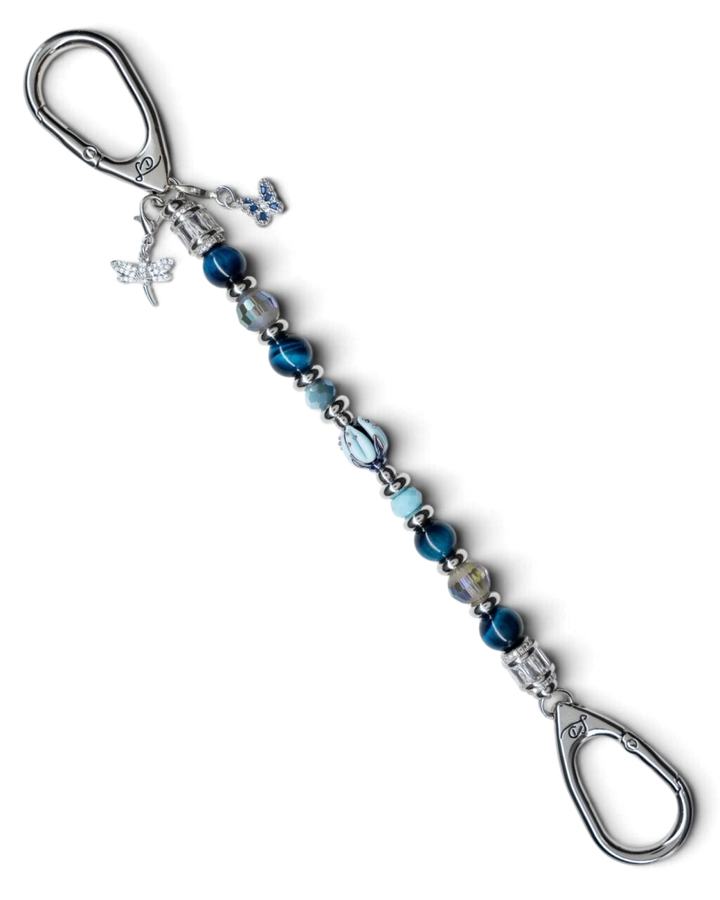LD Keyfinder Whispering Garden featuring a blue glass tulip, tiger eye beads, and dragonfly and butterfly charms.