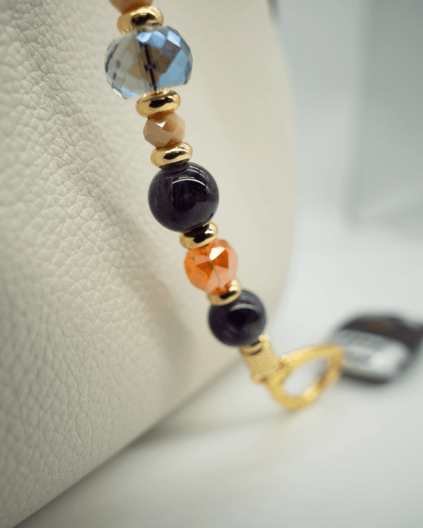 LD Keyfinder Whoo's There beaded accessory featuring amethyst, orange, and indigo crystals with 18KT gold-plated beads.