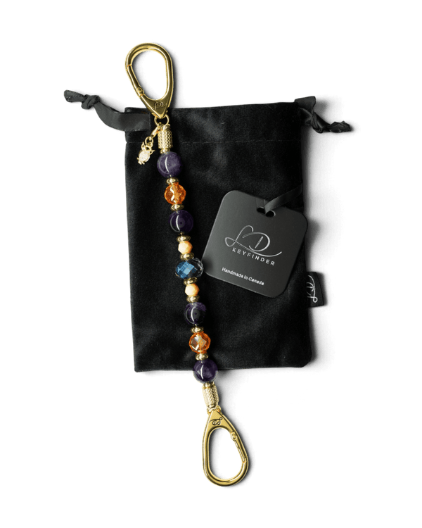 LD Keyfinder Whoo's There beaded keychain with amethyst, orange, peach, and indigo beads and a gold owl charm.