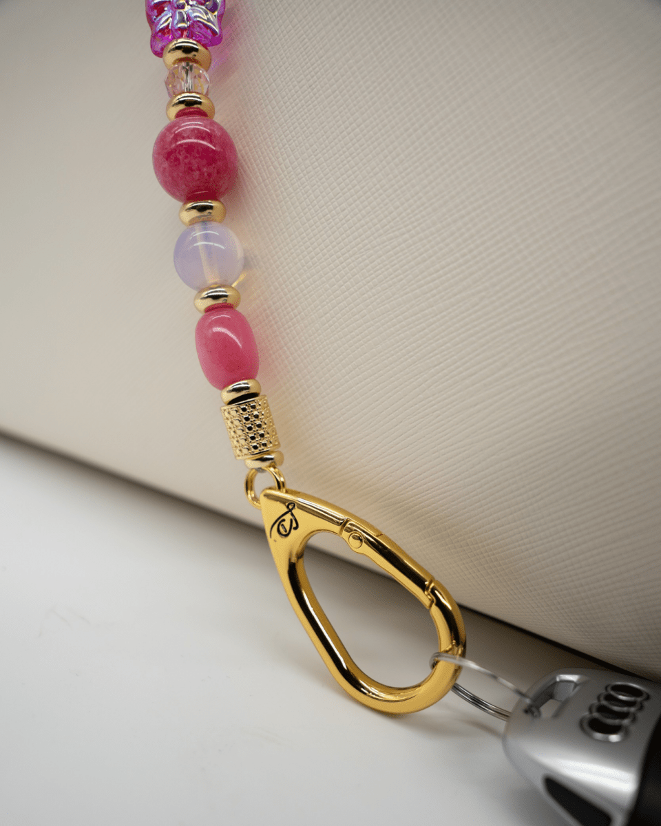 LD Keyfinder Wings of Hope beaded keychain with pink gemstones, gold-plated hardware, and a butterfly charm.