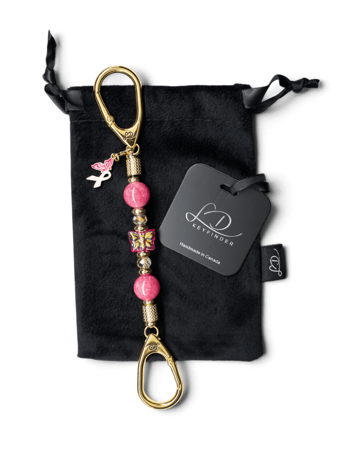 LD Keyfinder Wings of Hope Mini key chain with pink jade beads, gold-plated butterfly charm, and pink ribbon.