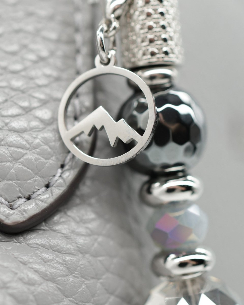 Polished stainless mountain charm