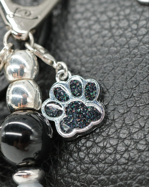 Sparkling black dog paw charm
