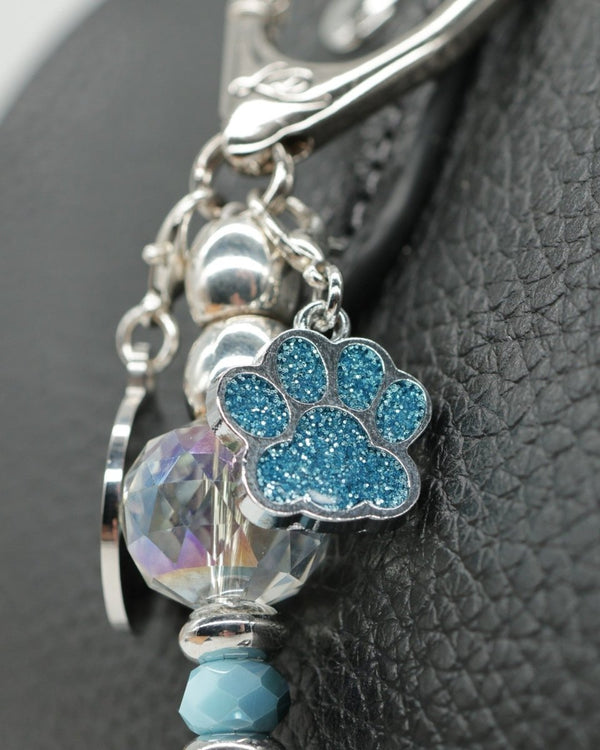 Sparkling teal dog paw charm