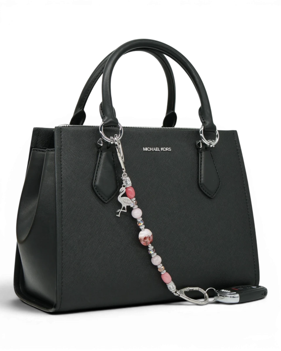 LD Keyfinder Flamingo Fiesta charm with pink beads, sterling silver, and rhinestone flamingo on a black handbag.